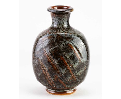 † JOHN LEACH (1939-2021) for Muchelney Pottery; a flattened bottle covered in mottled grey and tenmoku glaze with incised dec
