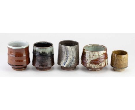ROELOF UYS (born 1971) for Leach Pottery; a stoneware yunomi covered in kaki and chun glaze, impressed figure and pottery mar