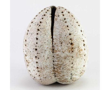 † ALAN WALLWORK (1931-2019); a large stoneware seed pod covered in pale grey glaze with impressed decoration and patches of i