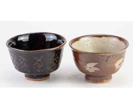 JIM MALONE (born 1946); a stoneware chawan covered in tenmoku breaking to kaki glaze with paddled decoration, impressed JM an