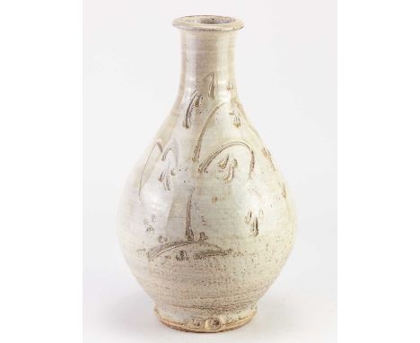 † JIM MALONE (born 1946); a stoneware Korean bottle covered in pale green and white glaze with incised decoration, impressed 