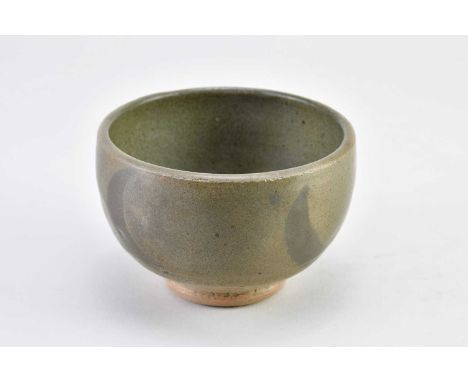 † NORAH BRADEN (1901-2001); a stoneware bowl covered in grey/green glaze with iron decoration, impressed NB mark, diameter 11