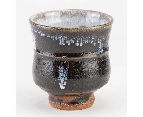 † JIM MALONE (born 1946); a stoneware yunomi covered in tenmoku breaking to kaki glaze with nuka pours, impressed JM and A (f