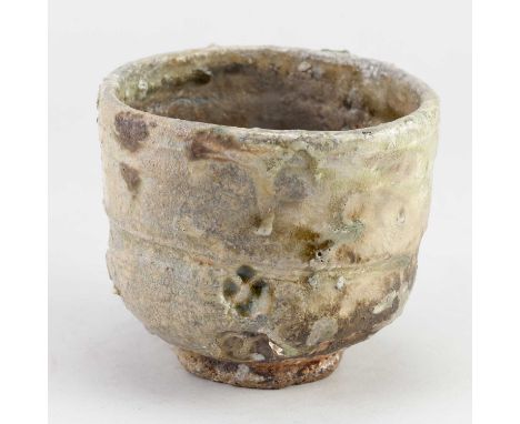 CHARLES BOUND (born 1939); a wood fired stoneware yunomi partially covered in green ash glaze, side fired on shells, impresse