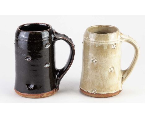 JIM MALONE (born 1946); a stoneware tankard covered in tenmoku breaking to kaki glaze with impressed decoration, impressed JM