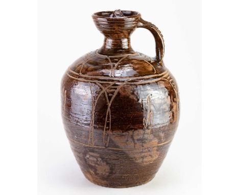 † MICHAEL CARDEW (1901-1983) for Wenford Bridge Pottery; a large stoneware flagon with screw top covered in tenmoku breaking 