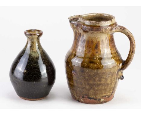 † MIKE DODD (born 1943); a stoneware jug covered in green ash and iron glaze, impressed MJD mark, height 15.5cm, and a small 