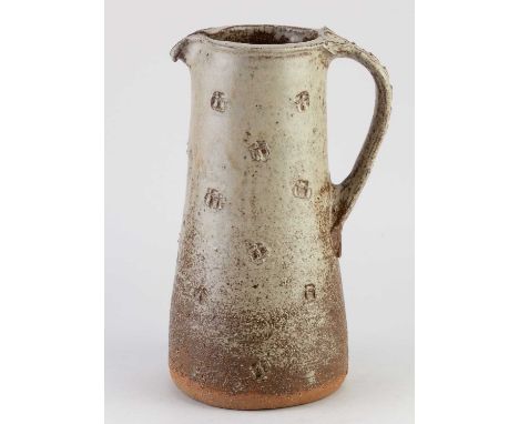 JIM MALONE (born 1946); a tall stoneware pitcher covered in green ash and iron glaze with impressed decoration, impressed JM 