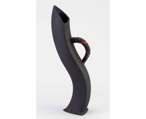 DAVID COHEN; a white earthenware jug of twisted form covered in black glaze with red enamel highlights, inscribed signature, 