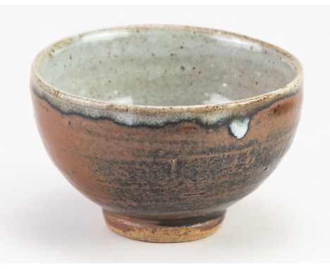 † WILLIAM MARSHALL (1923-2007); a stoneware bowl covered in tenmoku breaking to kaki glaze with grey ash rim, impressed WM, d