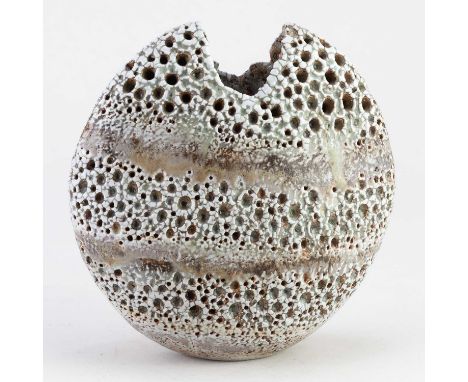 † ALAN WALLWORK (1931-2019); a stoneware pebble with impressed decoration forming horizontal bands picked out in green glaze 