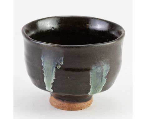 JIM MALONE (born 1946); a stoneware chawan covered in tenmoku glaze with copper pours, impressed JM and L (for Lessonhall) ma