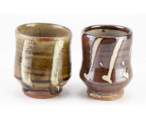 † MIKE DODD (born 1943); a stoneware yunomi covered in green ash glaze with white decoration, impressed MJD mark, height 10.5