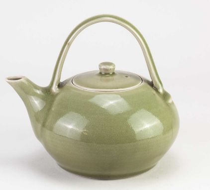† HARRY DAVIS (1910-1986) &amp; MAY DAVIS (1914-1998) for Crowan Pottery; a porcelain teapot covered in celadon glaze, impres