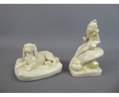 A Mid-20th Century Belleek figurine depicting a resting dog bearing the back stamp for period 1946-55 together with mid-20th 