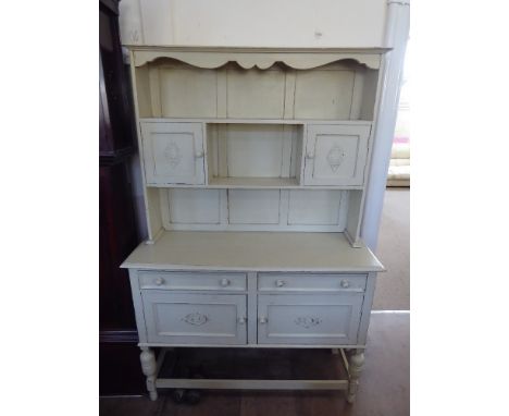 A Vintage Cream Painted French Cottage Dresser, with plate rack and two spice cupboards, two drawers and two cupboards beneat