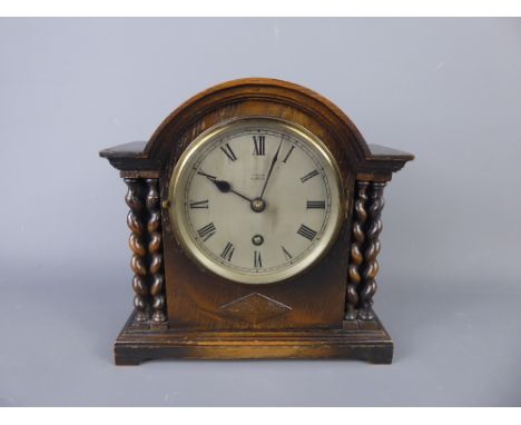 An Edwardian Oak Cased Mantel Clock, with blued hands, Edwards of Glasgow, with twin turned pillar supports, approx 23 x 20 c