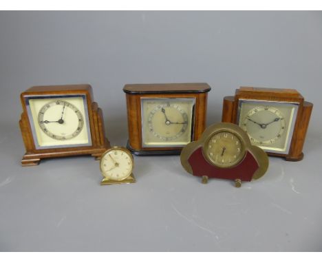 Three English Vintage Clocks made by 'W A Elliott', in Art Deco-style wooden cases, one with silver plaque to top inscribed w