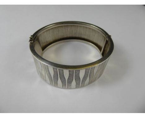 A Silver Bangle, mm DJ, stamped 925.