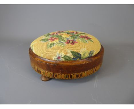 A Victorian Circular Fruitwood Foot Stool, with decorative inlay and tapestry top.