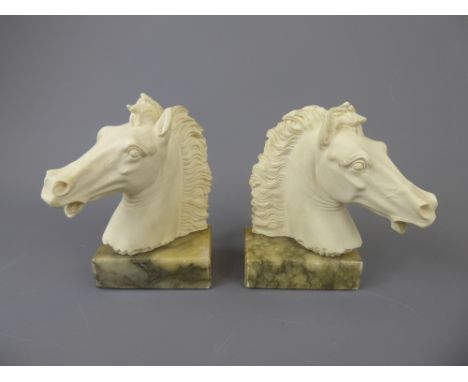 A Pair of Ceramic Italian Horse-head Book Ends on marble bases, approx 16 cms high.