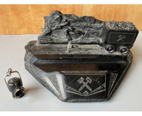 Polish carved coal folk art mining sculpture, inscribed 'Szombierki', W24cm, and a miniature carved wood mining lantern, H5.5
