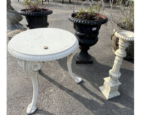 Cast iron garden items, comprising a pair of small black urns, H44cm, candlestick holder, and a low table (4)Shipping POA htt