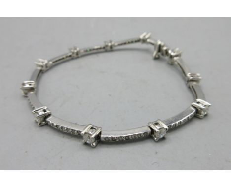 14ct white gold diamond set tennis bracelet, stamped 14k, L17cm, 8.38gShipping £23.00 plus vat (UK Only)