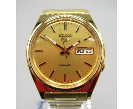 Seiko SKXL64K gold plated automatic wristwatch with day/date on matching bracelet with signed deployment clasp, signed sunbur