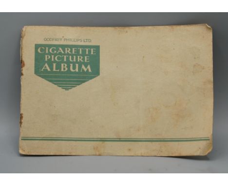 Continental silver cigarette case, cover enamelled with mistletoe, stamped 800, Edwardian silver pepperette on pedestal foot 