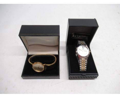 Aviatime stainless steel and gold plated quartz wristwatch with day/date on matching bracelet with deployment clasp, signed s