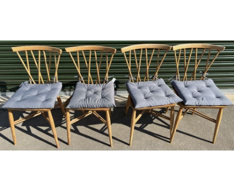 Four Ercol Model 376 Candlestick dining chairs with seat cushions, blonde/light finish, H80cmShipping POA https://www.bradley