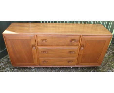 Ercol elm sideboard, three drawers with cutlery compartment, enclosed by two doors, on castors, W156cm D43cm H70cmShipping PO
