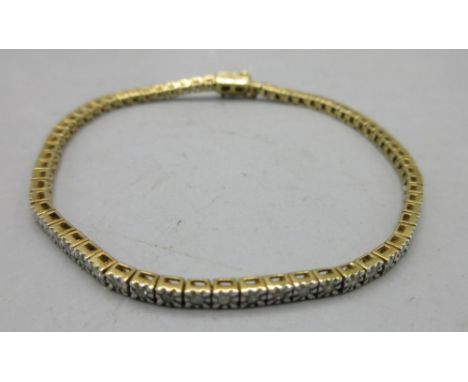 9ct yellow gold diamond set tennis bracelet, the 52 brilliant cut diamonds set in illusion setting, stamped 375, L19.5cm, 9.3
