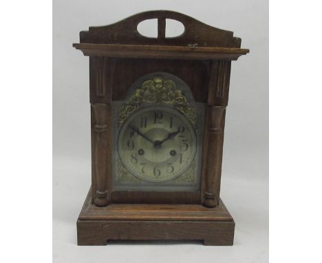 Badische, Black Forest, early 20th Century oak mantle clock, 7" break arch alloy dial with Arabic chapter ring and applied br