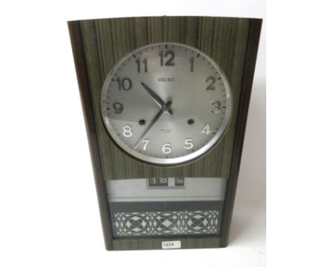 Vintage Seiko wall clock, with silvered Arabic dial, and day date, 30 day keywind movement, with key and pendulum, W26cm D11c