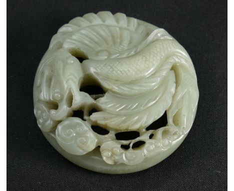 Ming Dynasty (1368-1644) A Chinese white Jade dragon pendant, diameter 5.5cm