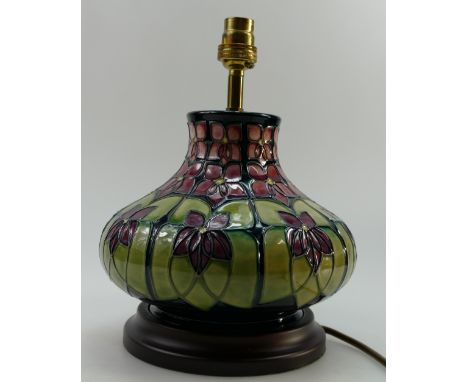 Moorcroft large lamp base decorated in the Violet design by Sally Tuffin, on wood base, pottery height 20cm with shade