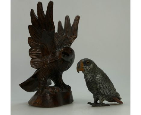 Wood carved model of an eagle and painted metal model of a parrot.  (2)