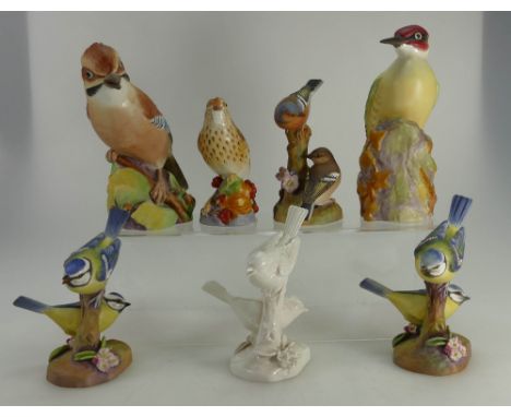 A collection of Royal Worcester birds to include Woodpecker, Jay 3248, Thrush, 2 x pair Bluetits, Chaffinches and pair unpain