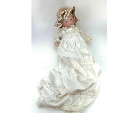 Armand Marseille early 20th century bisque headed baby doll with closed mouth and moving eyes in lace costume, marked AM Germ