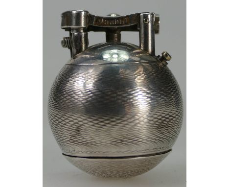 A Silver Dunhill unique golf ball lighter, hall marked for London 1928, patent & reg numbers ( slightly worn with some dents)