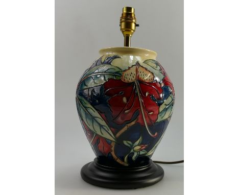 Moorcroft large lamp base decorated with flowers & leaves, on wood base, height of pottery 25cm with shade