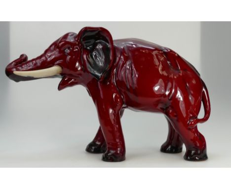 Royal Doulton Flambe model of large Bull Elephant with trunk up, impressed model number, height 28cm.  (black underglaze line