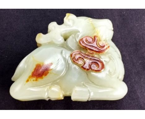 Qing Dynasty (1644-1911) A Chinese white and russet Jade deer pendant, length 5.9cm