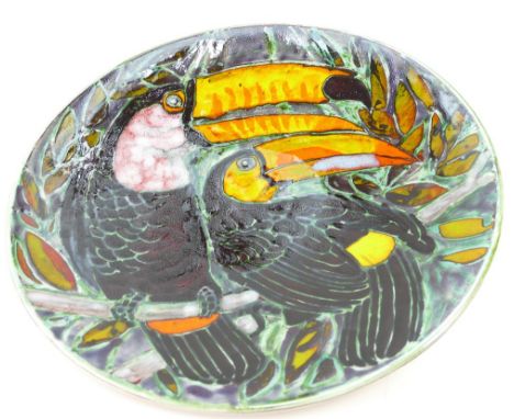 Large Poole Studio plaque initialed T.M to rear, decorated with Toucans, 41cm diameter.