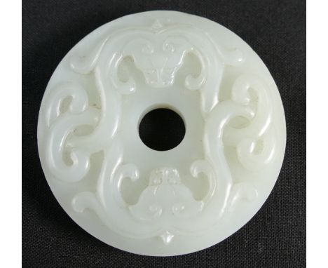 Qing Dynasty (1644-1911) A Chinese white Jade double dragon disc, diameter 5.3cm