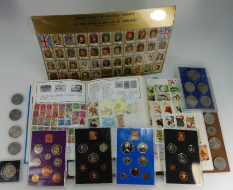 A large collection of various coins & stamps including sets of coinage of Great Britain from the 1970s, coin books, various o