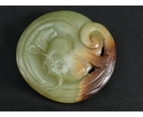 Qing Dynasty (1644-1911) A Chinese yellow Jade dragon-carp pendant, length 5.5cm