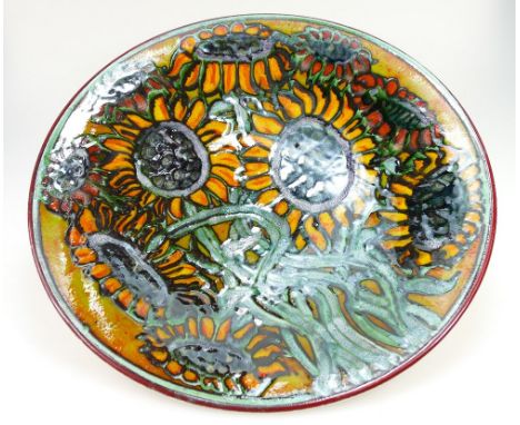 Large Poole Studio charger signed T.M to rear, decorated with sunflowers, diameter 41cm. 